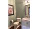 A traditional powder room features a white vanity with a marble countertop and a silver framed mirror at 11863 Edgefield Dr, Fishers, IN 46037
