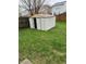 Backyard with green grass, a shed and a wooden fence around the yard at 1254 Kenwood Dr, Greenwood, IN 46143