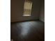 This bedroom is neutrally decorated with a wood-look floor and window at 1254 Kenwood Dr, Greenwood, IN 46143