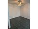 Bright dining room area featuring dark green tile floors and ceiling fan at 1254 Kenwood Dr, Greenwood, IN 46143