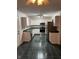 Clean kitchen featuring white cabinets, stainless steel appliances, and dark green tile flooring at 1254 Kenwood Dr, Greenwood, IN 46143