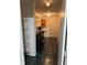 Well-lit laundry room features tile floor, washer and dryer hookups, and shelving at 1254 Kenwood Dr, Greenwood, IN 46143