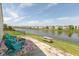 Relaxing backyard with comfortable chairs, outdoor seating, and a beautiful view of the serene pond at 12722 Brady Ln, Noblesville, IN 46060