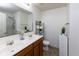 Bathroom with double sink vanity, large mirror, and a shower with glass doors at 12722 Brady Ln, Noblesville, IN 46060