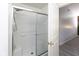 Bathroom with shower over tub with sliding glass door at 12722 Brady Ln, Noblesville, IN 46060