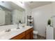 Bright bathroom with double vanity, a large mirror, and shower-tub combination at 12722 Brady Ln, Noblesville, IN 46060