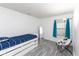 Bright bedroom with a white bed frame and a large window at 12722 Brady Ln, Noblesville, IN 46060