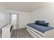 Inviting bedroom with a comfortable trundle bed, neutral tones, and natural light, offering a serene retreat at 12722 Brady Ln, Noblesville, IN 46060
