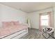 Cozy bedroom with a comfortable daybed, plush decor, and soft lighting, creating a welcoming space at 12722 Brady Ln, Noblesville, IN 46060