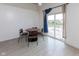 Dining area with modern sliding glass doors leading to the patio and scenic lake views at 12722 Brady Ln, Noblesville, IN 46060