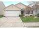Charming single-story home featuring a well-manicured lawn, two-car garage, and a welcoming front porch at 12722 Brady Ln, Noblesville, IN 46060