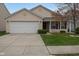 Charming single-story home with a well-manicured lawn and attached garage, perfect for suburban living at 12722 Brady Ln, Noblesville, IN 46060