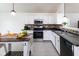 Modern kitchen with white cabinets and stainless steel appliances, perfect for cooking and entertaining guests at 12722 Brady Ln, Noblesville, IN 46060