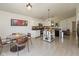 Bright kitchen and dining area with white cabinetry, modern appliances, and lots of natural light at 12722 Brady Ln, Noblesville, IN 46060