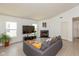 Comfortable living room with a cozy fireplace and large windows providing lots of natural light at 12722 Brady Ln, Noblesville, IN 46060