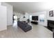 Open-concept living room with fireplace and modern decor, ideal for entertaining and relaxing at 12722 Brady Ln, Noblesville, IN 46060