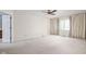 Spacious bedroom with neutral carpet, curtains, and a ceiling fan at 13778 Driftwood Dr, Carmel, IN 46033