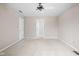 Bright bedroom with a ceiling fan and doorway to a hallway, ready for personalization at 13778 Driftwood Dr, Carmel, IN 46033