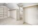 Walk-in closet with built-in shelves and ample hanging space at 13778 Driftwood Dr, Carmel, IN 46033