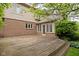 Spacious wooden deck extending from the brick home, ideal for outdoor dining and relaxation at 13778 Driftwood Dr, Carmel, IN 46033