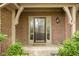 Inviting front door framed by brick and sidelights, offering a glimpse of the home's character at 13778 Driftwood Dr, Carmel, IN 46033