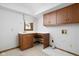 Functional laundry room with wooden cabinetry, sink, and hookups ready for appliances at 13778 Driftwood Dr, Carmel, IN 46033