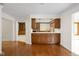 Open living space with wood cabinets and hardwood floors at 13778 Driftwood Dr, Carmel, IN 46033