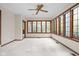 Bright sunroom with large windows overlooking the backyard at 13778 Driftwood Dr, Carmel, IN 46033