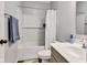 Well-lit bathroom featuring a shower-tub combo with a subway tile surround and a modern vanity at 1407 Allen Ct, Shelbyville, IN 46176