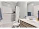 Well-lit bathroom featuring a shower-tub combo with a subway tile surround and a modern vanity at 1407 Allen Ct, Shelbyville, IN 46176