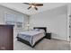 Cozy bedroom with neutral color scheme, a comfortable bed, and natural light from a window at 1407 Allen Ct, Shelbyville, IN 46176