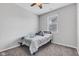 Cozy bedroom with a ceiling fan, a twin bed and a window that provides natural light at 1407 Allen Ct, Shelbyville, IN 46176
