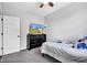 Bedroom featuring neutral walls, plush carpet, and a wardrobe with a television on top at 1407 Allen Ct, Shelbyville, IN 46176