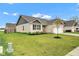 Charming single-story brick home featuring a well-manicured lawn and inviting curb appeal at 1407 Allen Ct, Shelbyville, IN 46176