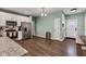 Modern kitchen with stainless steel appliances and wood-look flooring at 1407 Allen Ct, Shelbyville, IN 46176