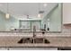 Granite countertops and stainless steel sink in kitchen at 1407 Allen Ct, Shelbyville, IN 46176