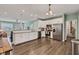Spacious kitchen features white cabinetry, stainless steel appliances, and hardwood floors at 1407 Allen Ct, Shelbyville, IN 46176