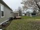 Large backyard with deck and several storage sheds and mature trees provides great outdoor space at 1424 Ashley Dr, Lebanon, IN 46052