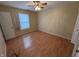 Neutral bedroom features laminate flooring and a ceiling fan providing comfort and style at 1424 Ashley Dr, Lebanon, IN 46052