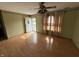 Inviting living room with a ceiling fan, wood flooring, and ample natural light at 1424 Ashley Dr, Lebanon, IN 46052