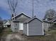 Backyard showing a gray home with vinyl siding and a detached storage building, perfect for outdoor living at 1445 S Belmont Ave, Indianapolis, IN 46221