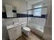 Modern bathroom with tiled shower, sleek vanity, and contemporary fixtures for a fresh look at 1445 S Belmont Ave, Indianapolis, IN 46221