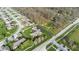 Overhead view of a lovely home with an expansive lawn, mature trees, and a paved driveway in a quiet neighborhood at 1484 N County Road 900 E, Avon, IN 46123