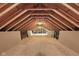 Spacious unfinished attic with exposed beams, offering potential for customization and extra storage at 1484 N County Road 900 E, Avon, IN 46123