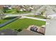 A well-maintained backyard is seen from above, featuring a wooden deck with an outdoor seating area at 1484 N County Road 900 E, Avon, IN 46123
