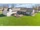 From above, the back of this home features a spacious deck complete with a hot tub and patio furniture at 1484 N County Road 900 E, Avon, IN 46123