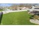 The aerial view highlights a big yard, enclosed by a white fence, with a wooden deck for outdoor relaxation at 1484 N County Road 900 E, Avon, IN 46123