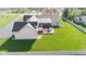 Aerial view showcases a lush backyard with a wooden deck that includes a hot tub and cozy seating at 1484 N County Road 900 E, Avon, IN 46123