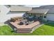 A lush, green backyard is visible from an aerial view, showcasing a deck and well manicured landscaping at 1484 N County Road 900 E, Avon, IN 46123