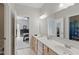 Spacious bathroom featuring double sinks, ample counter space, and a view into the adjacent bedroom at 1484 N County Road 900 E, Avon, IN 46123
